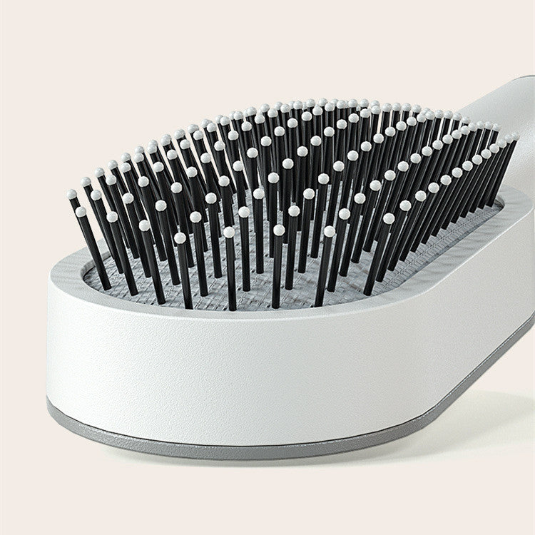 Relax & Clean Comb : Brosse à cheveux auto-nettoyante en un clic.